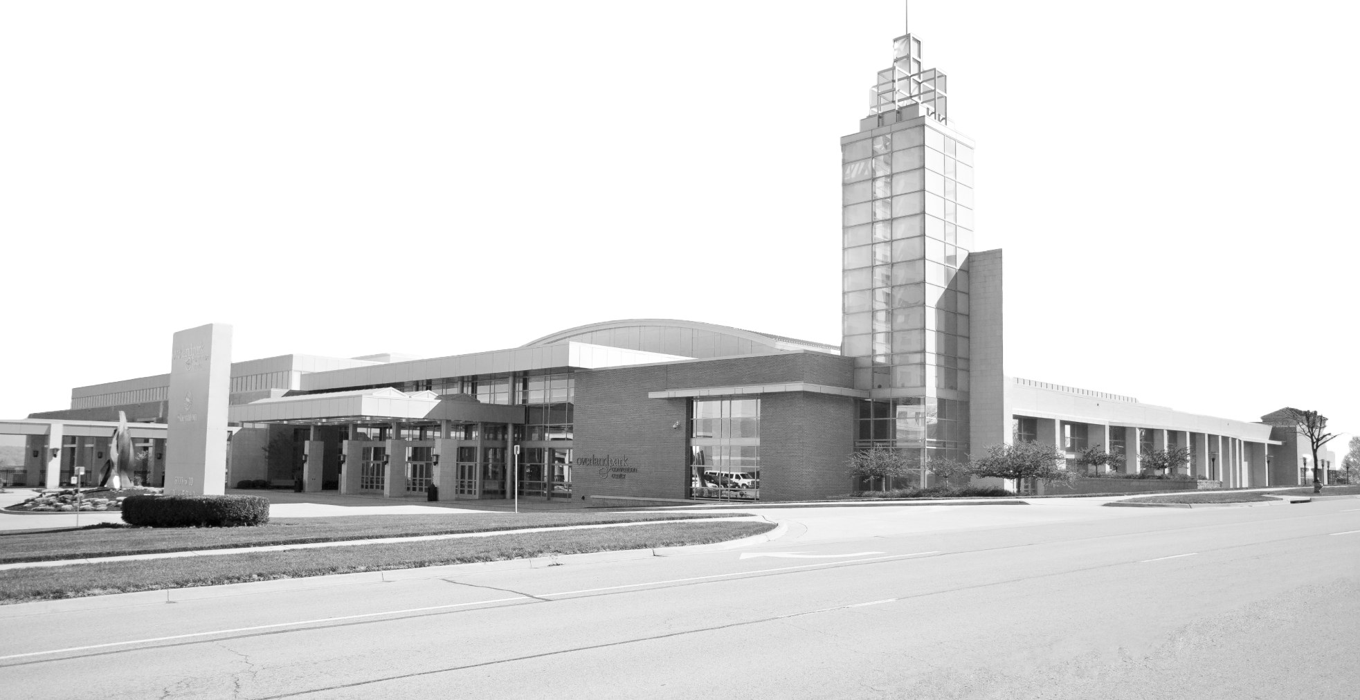 black and white image of the outside of the overland park convention center building